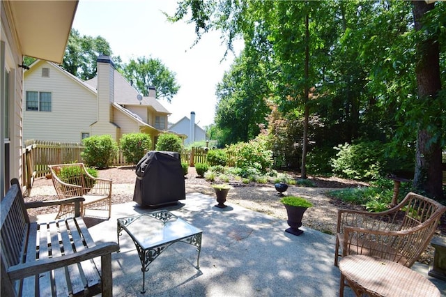 340 Channings Lake Dr, Lawrenceville, GA 30043 - fenced backyard with grilling area and a patio