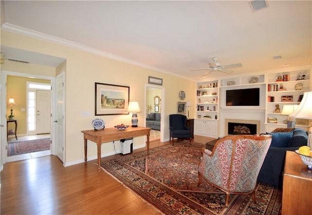 340 Channings Lake Dr, Lawrenceville, GA 30043 - living room with a ceiling fan, ornamental molding, wood finished floors, and a fireplace