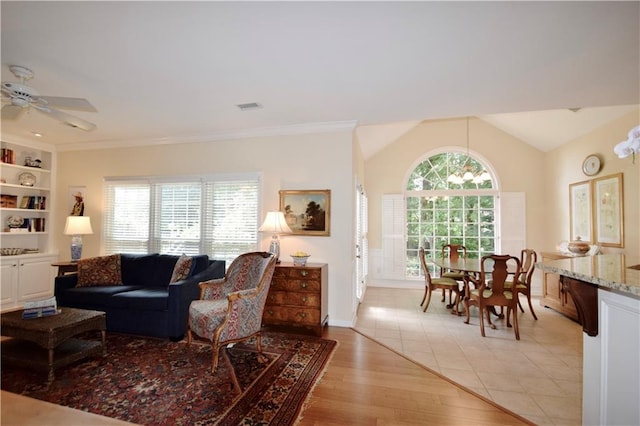 340 Channings Lake Dr, Lawrenceville, GA 30043 - living room with light wood-type flooring, lofted ceiling, a ceiling fan, and built in features