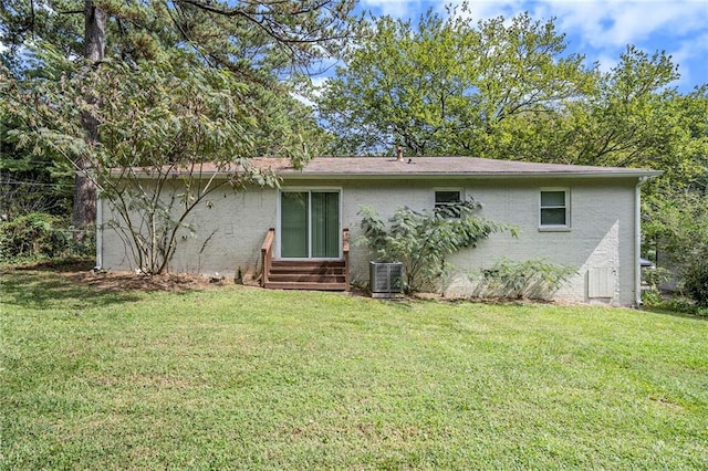 2623 Rex Ave SW, Atlanta, GA 30331 - rear view of property featuring brick siding, a yard, entry steps, and central AC unit
