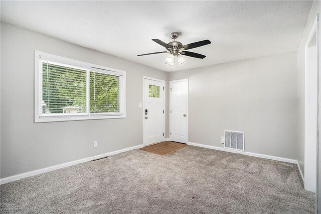 2623 Rex Ave SW, Atlanta, GA 30331 - unfurnished room with baseboards, a ceiling fan, visible vents, and carpet