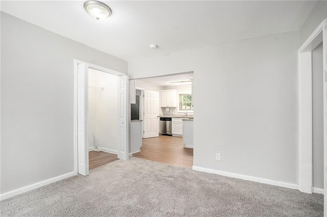 2623 Rex Ave SW, Atlanta, GA 30331 - unfurnished living room featuring light carpet and baseboards