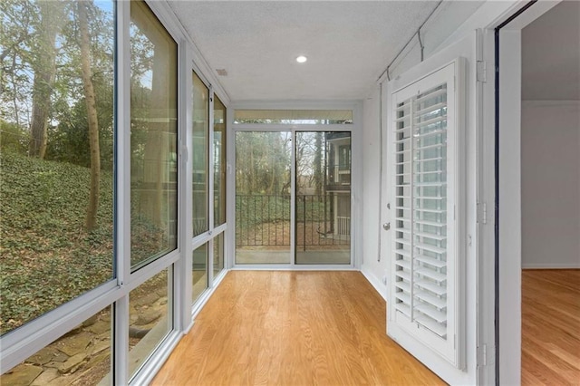 unfurnished sunroom featuring plenty of natural light