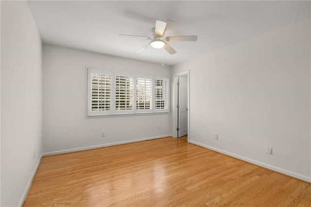 unfurnished room with ceiling fan and light hardwood / wood-style floors