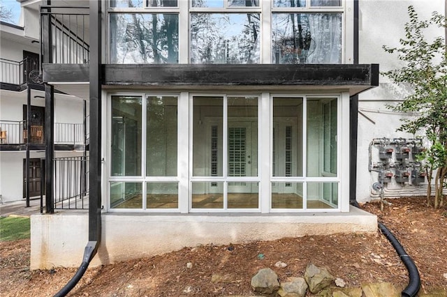 view of home's exterior with a sunroom