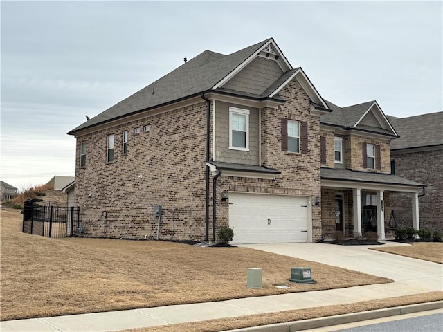 3566 Andover Way, Buford, GA 30519 - view of front of house with an attached garage, covered porch, concrete driveway, brick siding, and roof with shingles