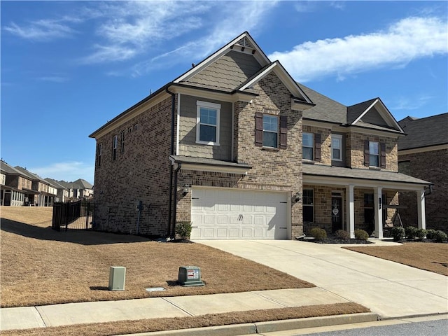 3566 Andover Way, Buford, GA 30519 - view of front of property with covered porch, concrete driveway, brick siding, and a garage