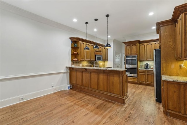 119 Kennemer Ct, Duluth, GA 30097 - kitchen with appliances with stainless steel finishes, brown cabinetry, tasteful backsplash, ornamental molding, and recessed lighting