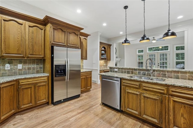 119 Kennemer Ct, Duluth, GA 30097 - kitchen with stainless steel appliances, a sink, light wood finished floors, tasteful backsplash, and recessed lighting