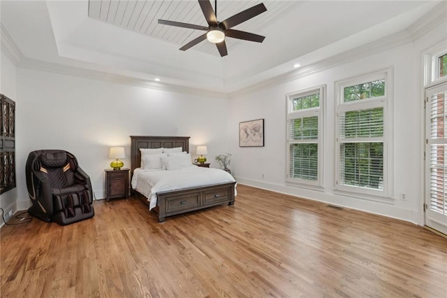119 Kennemer Ct, Duluth, GA 30097 - bedroom with a tray ceiling, light wood-style flooring, baseboards, crown molding, and a ceiling fan