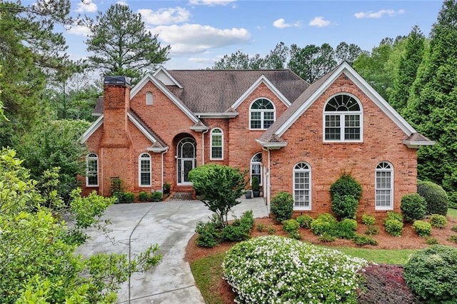 119 Kennemer Ct, Duluth, GA 30097 - view of front of home with a chimney and brick siding