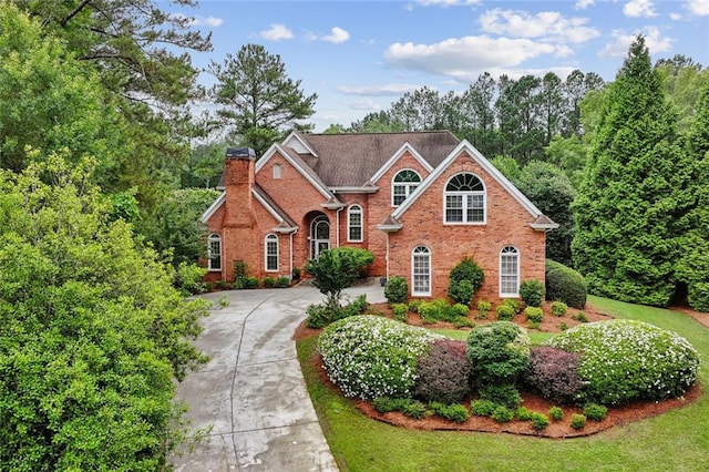 119 Kennemer Ct, Duluth, GA 30097 - view of front of property with a chimney, concrete driveway, and brick siding
