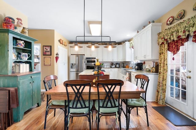 dining room featuring light wood-type flooring