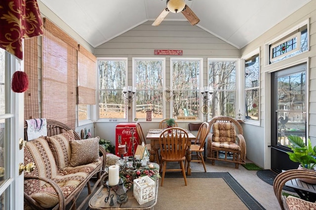 sunroom featuring a ceiling fan and lofted ceiling