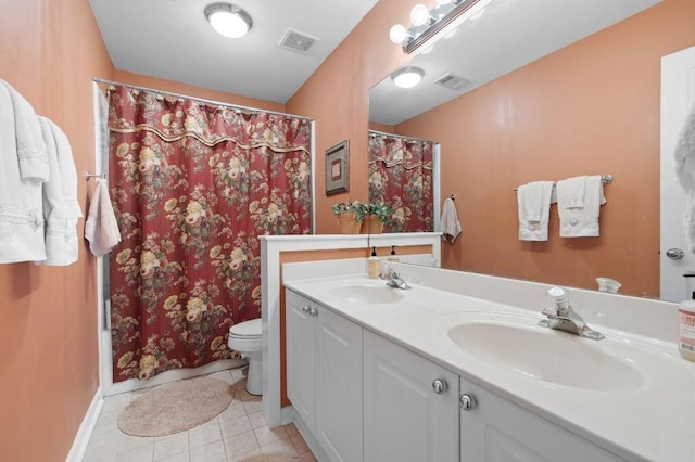 bathroom with a sink, visible vents, toilet, and tile patterned flooring