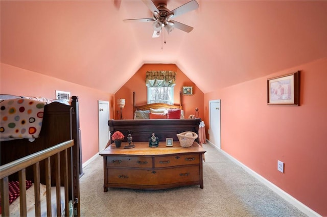 bedroom with visible vents, a ceiling fan, baseboards, lofted ceiling, and light colored carpet