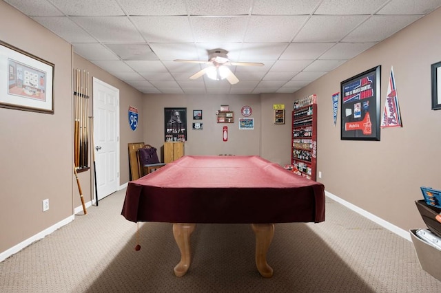 playroom with light carpet, a drop ceiling, ceiling fan, and baseboards