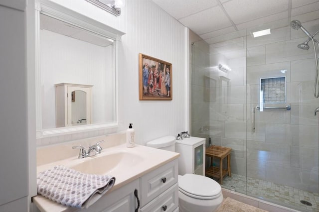 full bath featuring vanity, toilet, and a stall shower