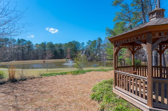 view of yard with a gazebo and a water view