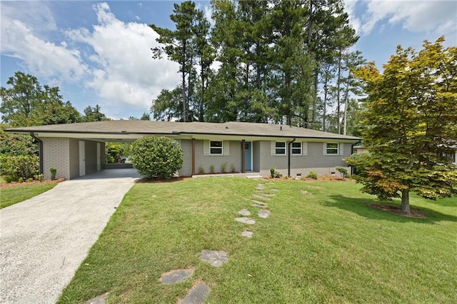 ranch-style house featuring a front yard and a carport