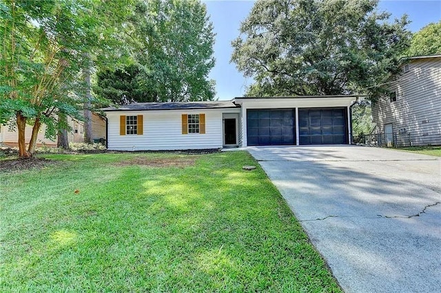2508 Wagon Trce, Duluth, GA 30096 - ranch-style house featuring an attached garage, concrete driveway, and a front lawn