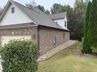 view of home's exterior with a yard