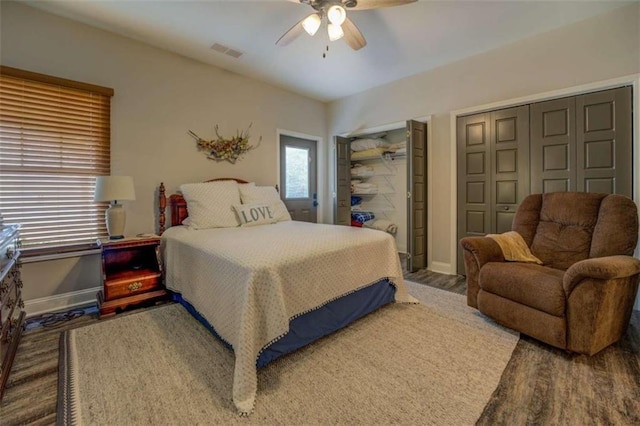 bedroom featuring dark wood-type flooring and ceiling fan