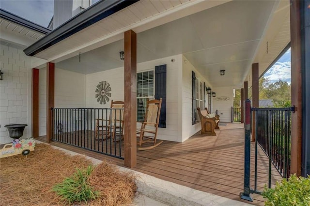 wooden deck featuring covered porch