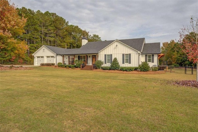 ranch-style house with a garage and a front lawn