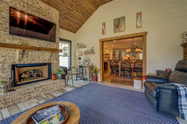 living room featuring wooden ceiling, hardwood / wood-style flooring, a chandelier, an outdoor brick fireplace, and high vaulted ceiling