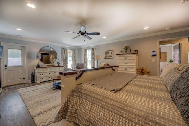 bedroom featuring ceiling fan, hardwood / wood-style floors, and ornamental molding