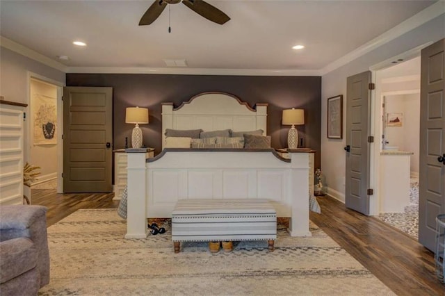 bedroom with ceiling fan, crown molding, and dark wood-type flooring