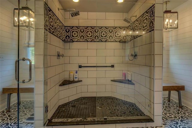 bathroom featuring a shower with door and tile patterned flooring