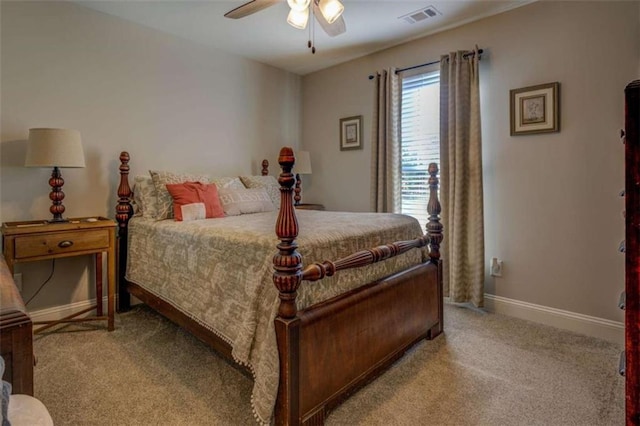 bedroom with ceiling fan and light carpet