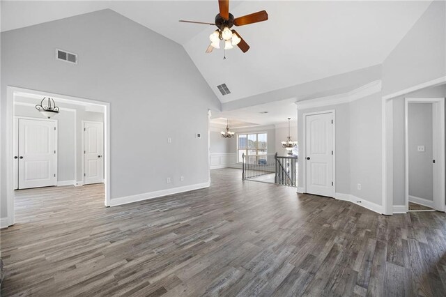 unfurnished living room featuring visible vents, ceiling fan with notable chandelier, high vaulted ceiling, and wood finished floors