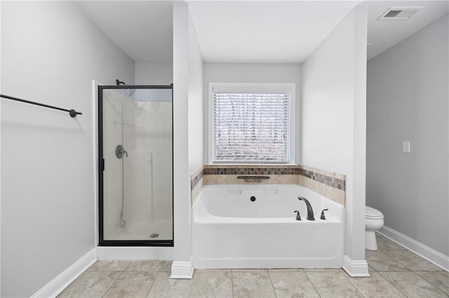 bathroom with visible vents, a stall shower, tile patterned flooring, a garden tub, and toilet