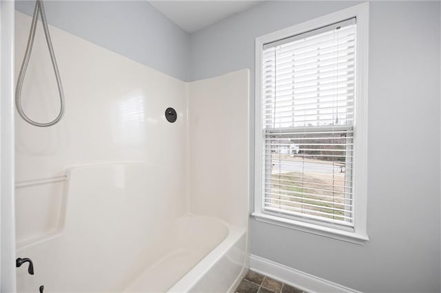 full bathroom featuring a wealth of natural light, baseboards, and  shower combination