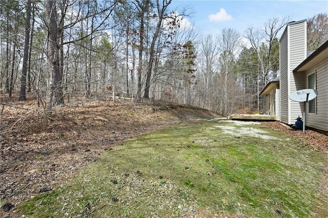 view of yard featuring a wooden deck