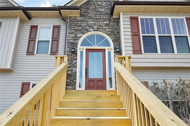 entrance to property with stone siding