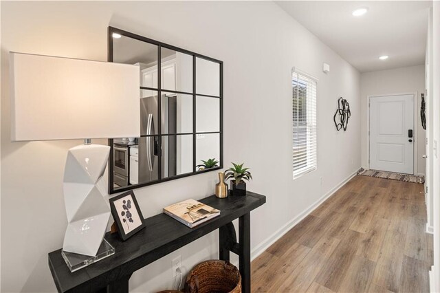 204 Epping St Unit 2, Stockbridge, GA 30281 - hallway with baseboards, recessed lighting, and wood finished floors