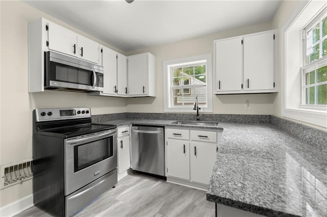 1098 Cascade Cir SW, Atlanta, GA 30311 - kitchen with stainless steel appliances, a sink, and plenty of natural light