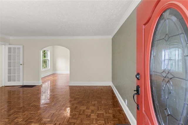 1098 Cascade Cir SW, Atlanta, GA 30311 - foyer with arched walkways, baseboards, a textured ceiling, and ornamental molding