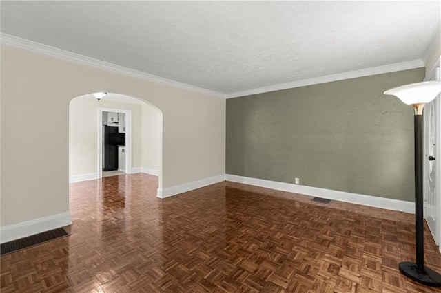 1098 Cascade Cir SW, Atlanta, GA 30311 - empty room featuring arched walkways, baseboards, crown molding, and a textured ceiling