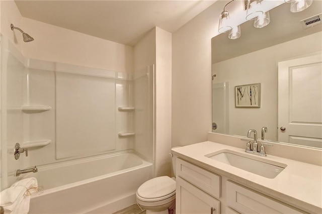 bathroom featuring toilet, bathtub / shower combination, visible vents, and vanity