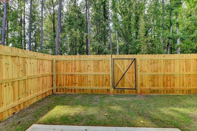 view of yard with a gate and fence