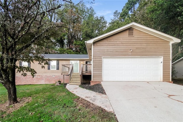 view of front facade with a front yard and a garage