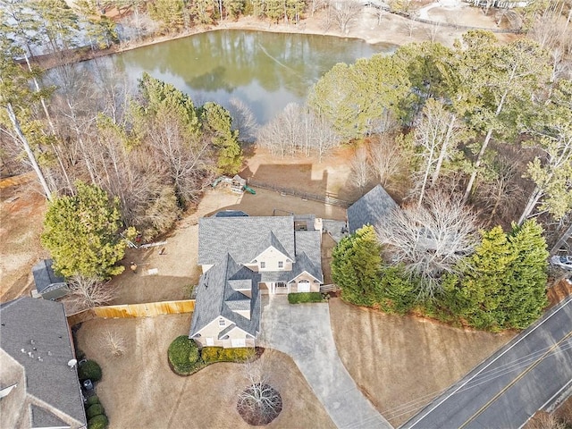 birds eye view of property with a water view