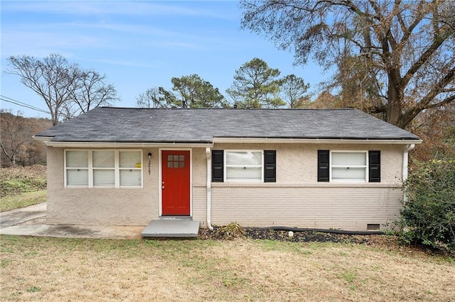 ranch-style house featuring a front lawn