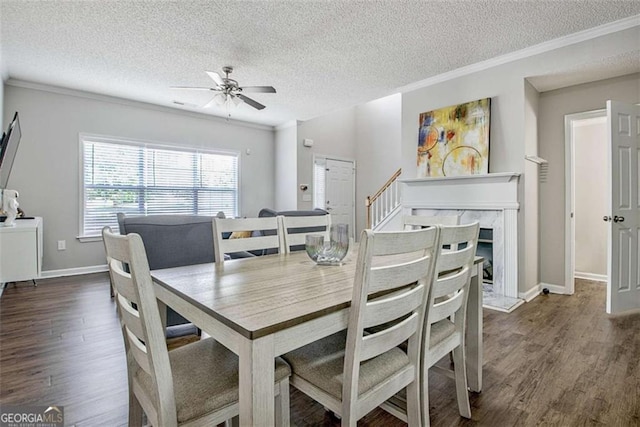 5 Corbel Way, Newnan, GA 30265 - dining area with a textured ceiling, ornamental molding, wood finished floors, a ceiling fan, and baseboards