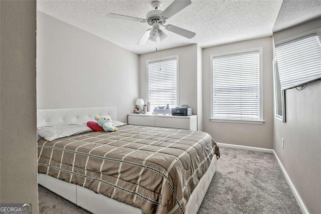 5 Corbel Way, Newnan, GA 30265 - carpeted bedroom with a textured ceiling, baseboards, and ceiling fan
